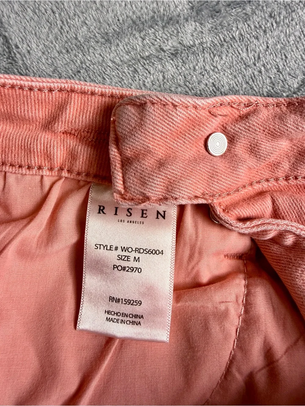 Risen Women’s High Rise Distressed Asymmetrical Coral Jean Shorts- Medium